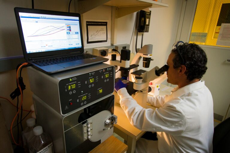 Researcher looking at genes
